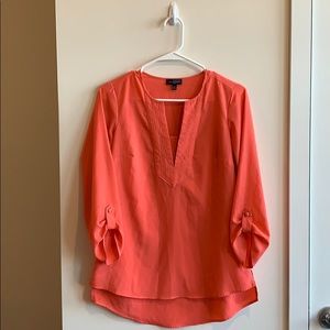 Slightly high, low, salmon colored blouse